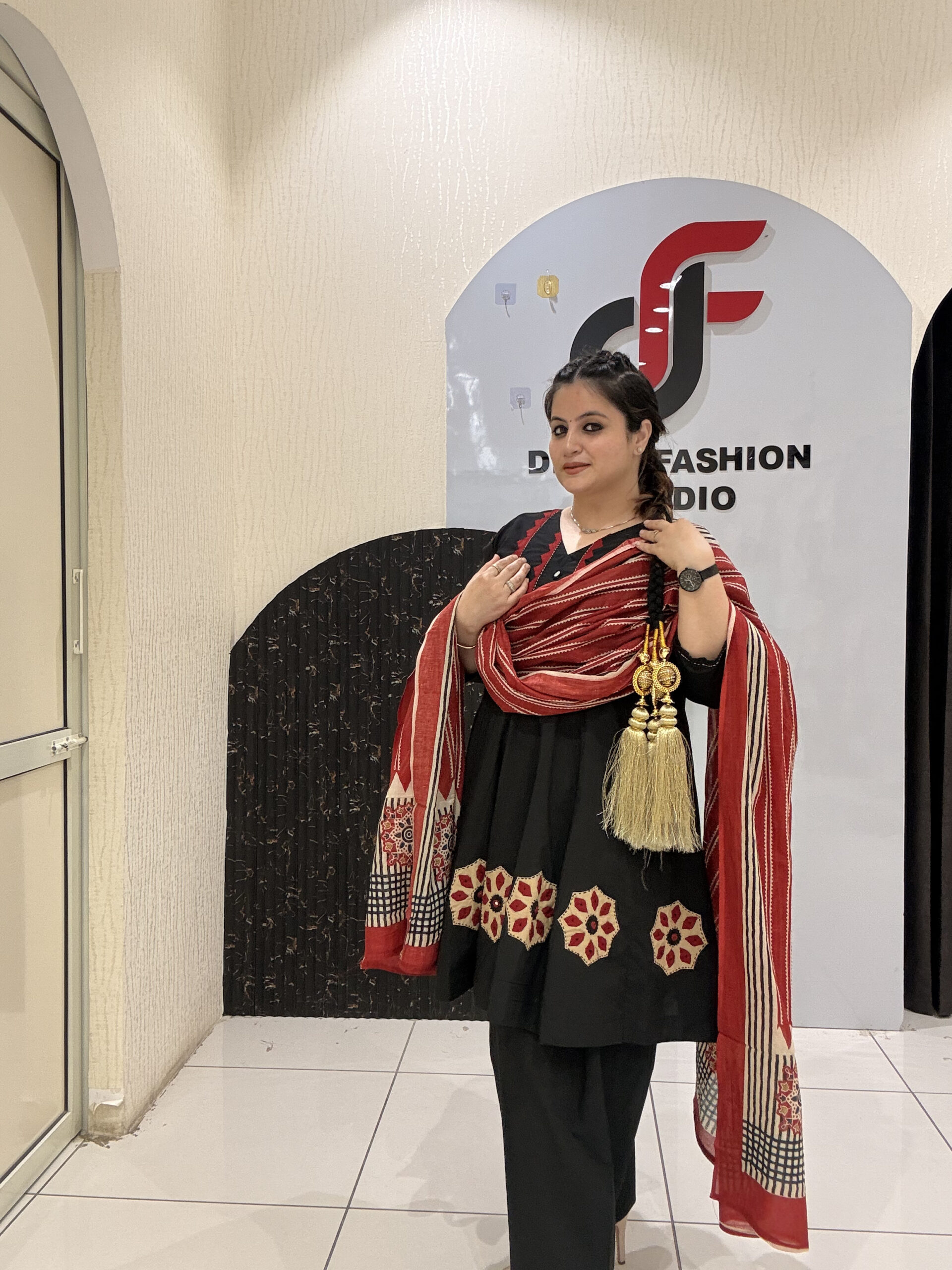 Elegant black pure cotton suit set featuring red and beige embroidery with a matching printed dupatta