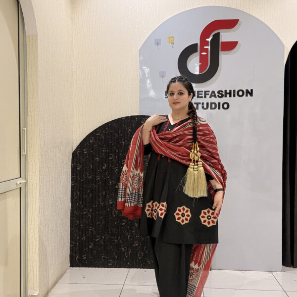 Elegant black pure cotton suit set featuring red and beige embroidery with a matching printed dupatta