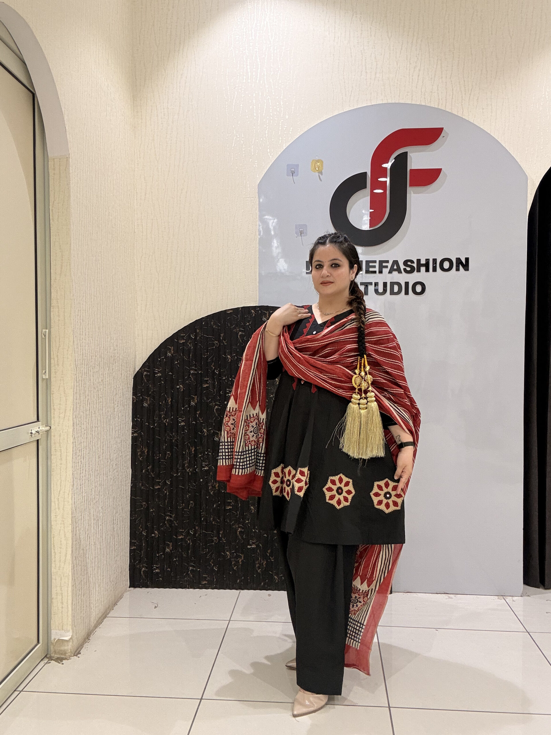 Elegant black pure cotton suit set featuring red and beige embroidery with a matching printed dupatta