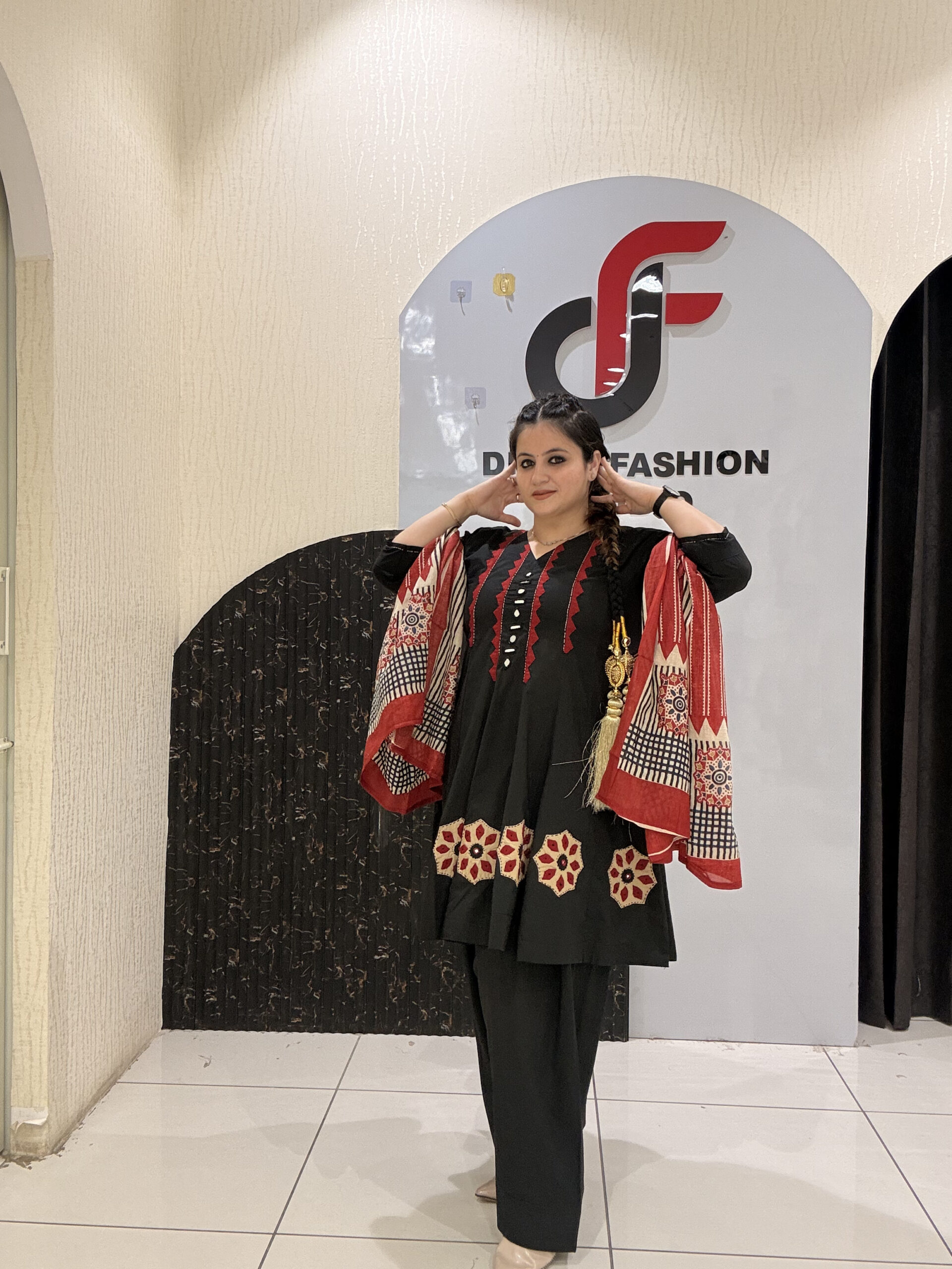 Elegant black pure cotton suit set featuring red and beige embroidery with a matching printed dupatta