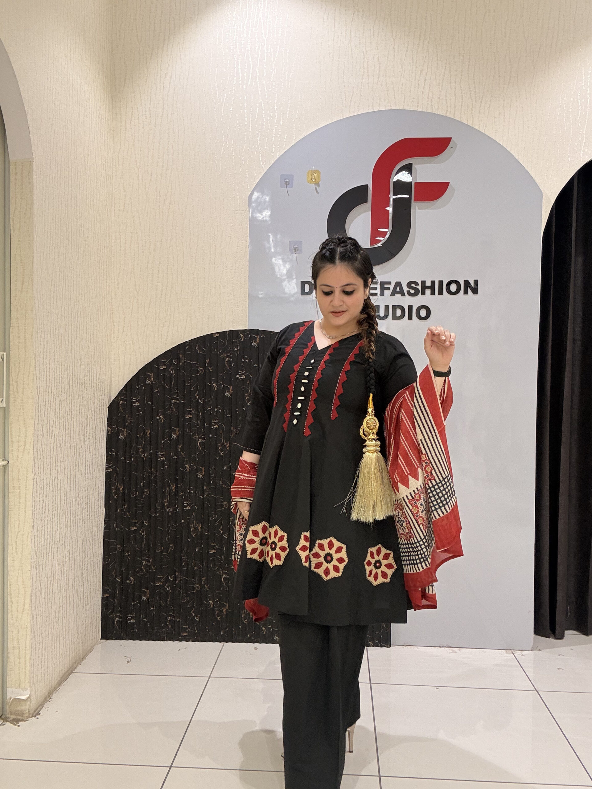 Elegant black pure cotton suit set featuring red and beige embroidery with a matching printed dupatta