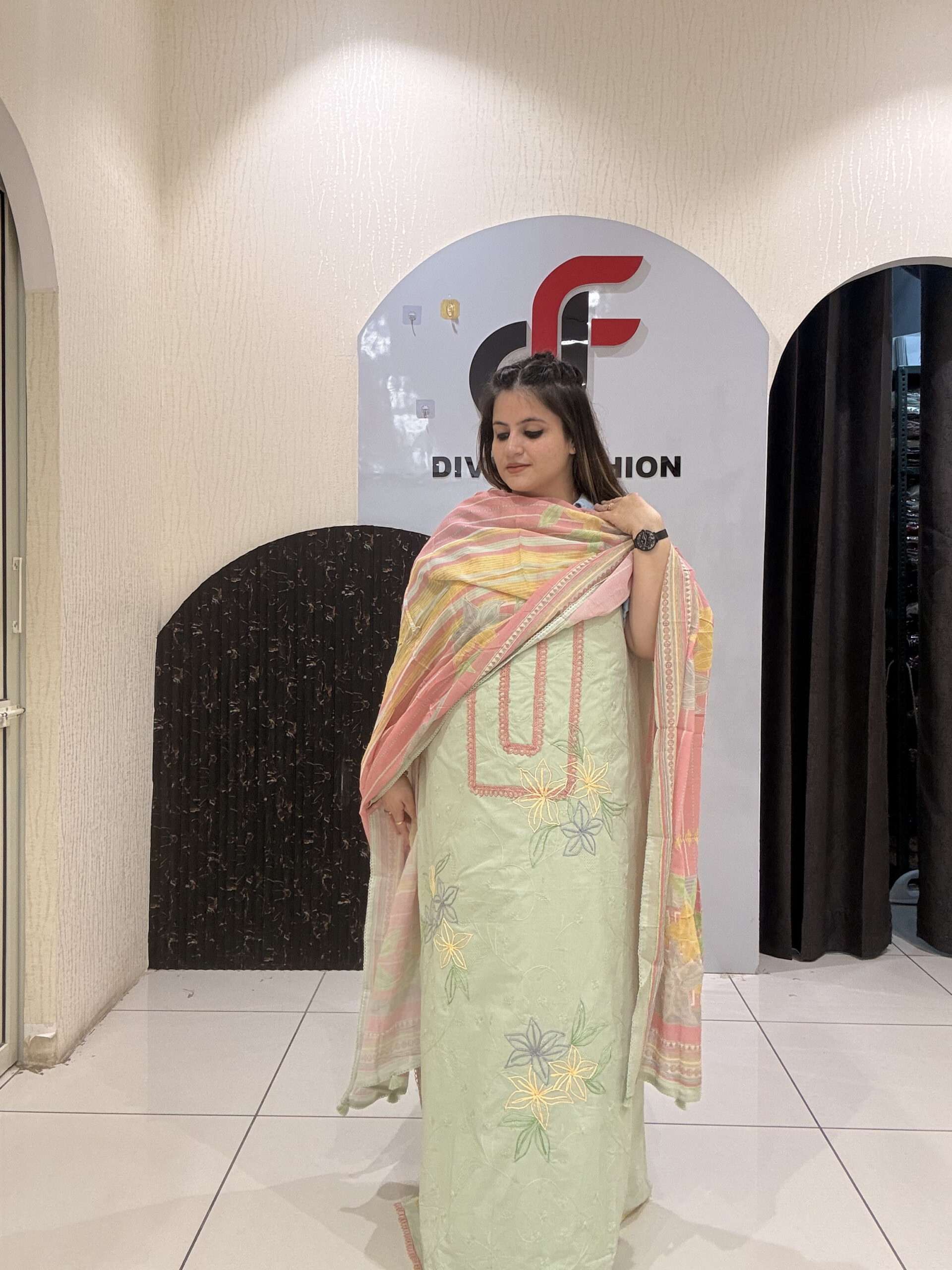 Elegant, unstitched cotton suits featuring delicate thread embroidery by Divine Fashion Studio