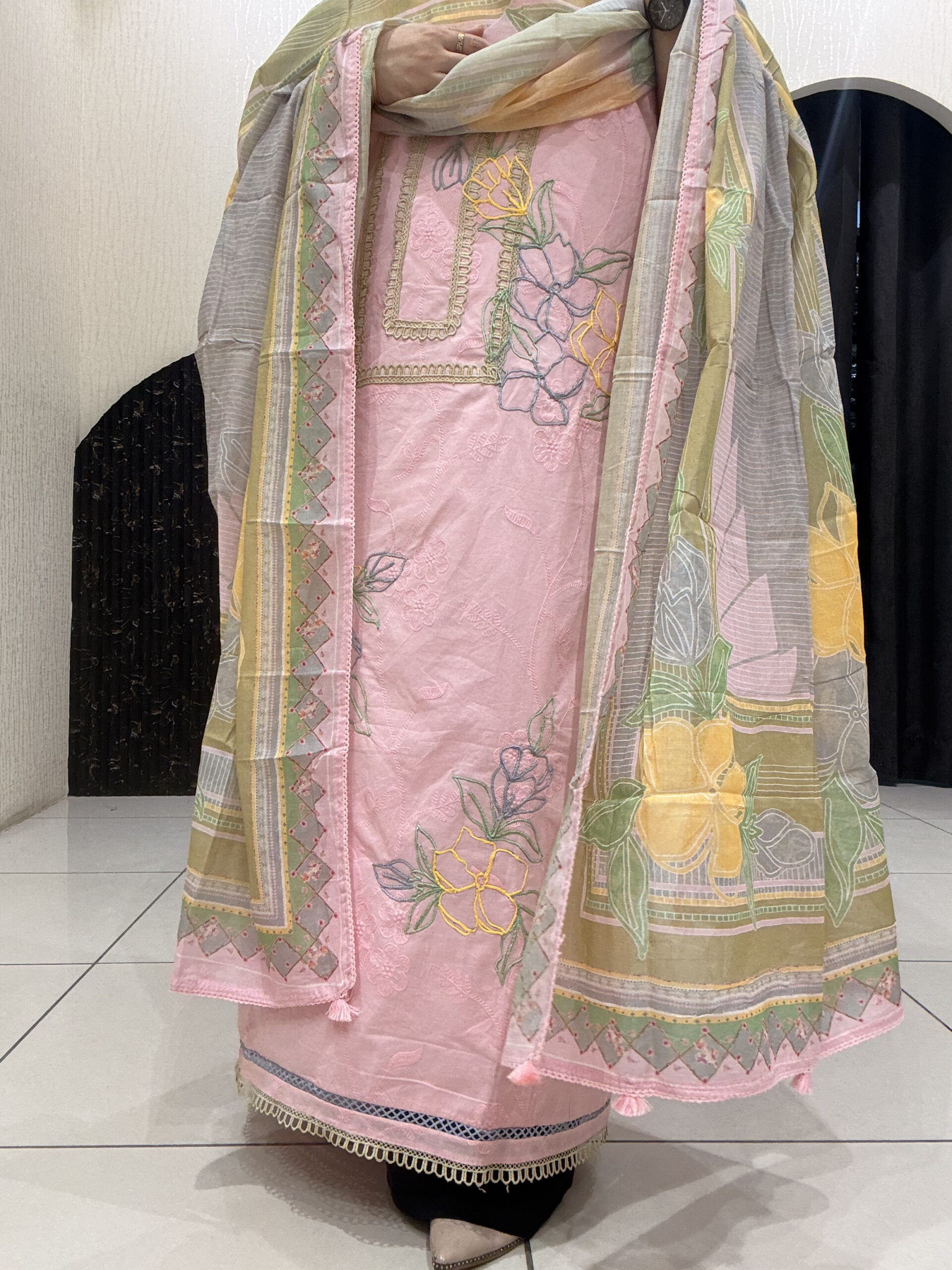Elegant, unstitched cotton suits featuring delicate thread embroidery and pastel hues
