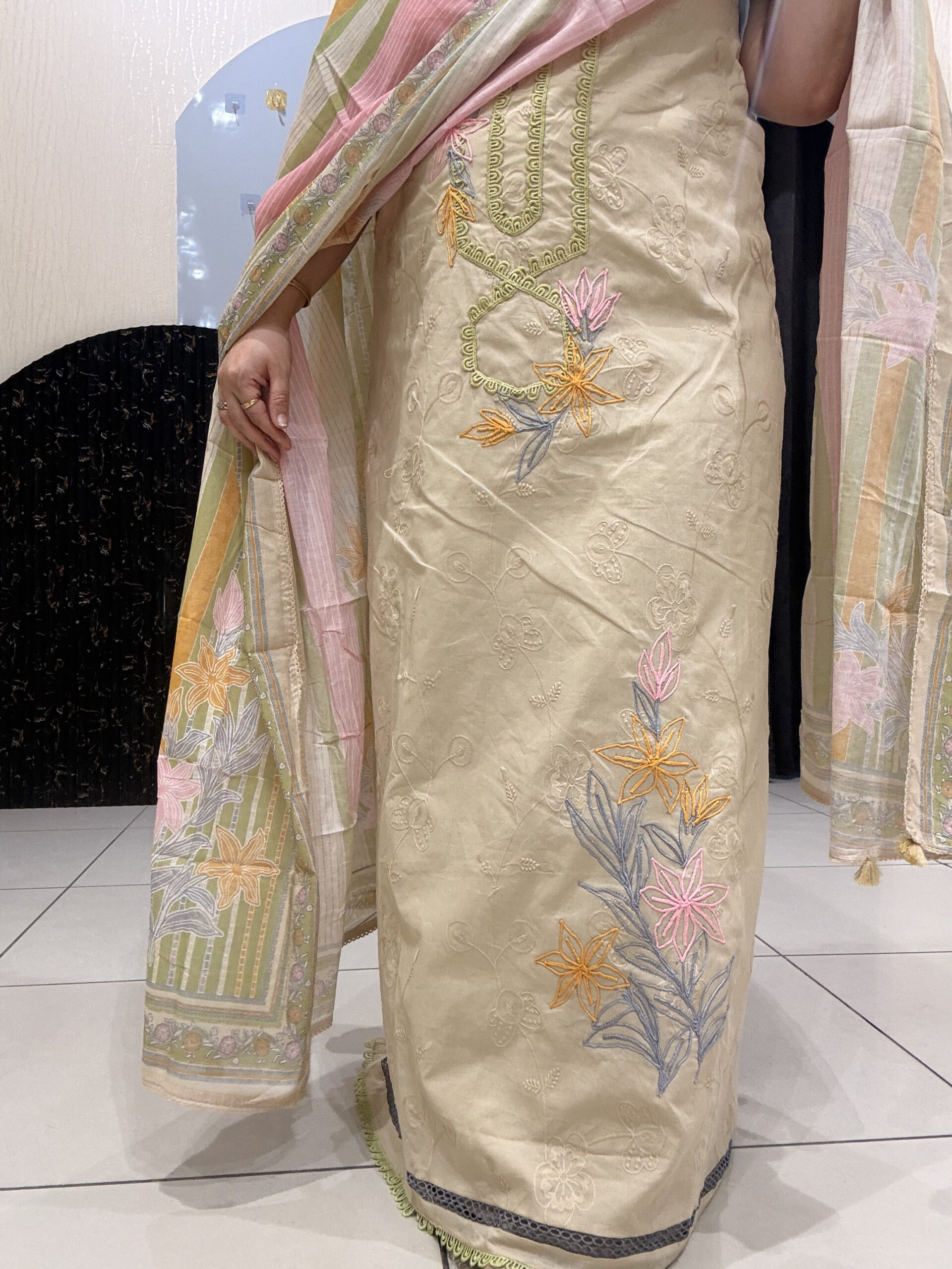 Elegant, unstitched cotton suits featuring delicate thread embroidery and pastel hues