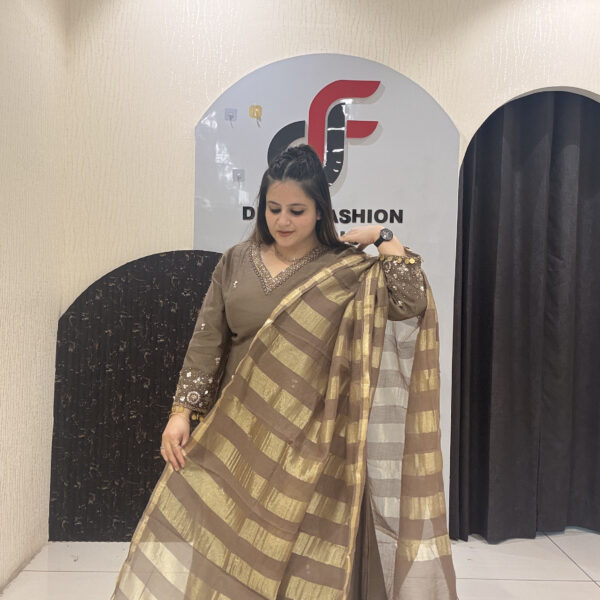 Sophisticated brown Mul suit featuring delicate embroidery and a golden striped dupatta