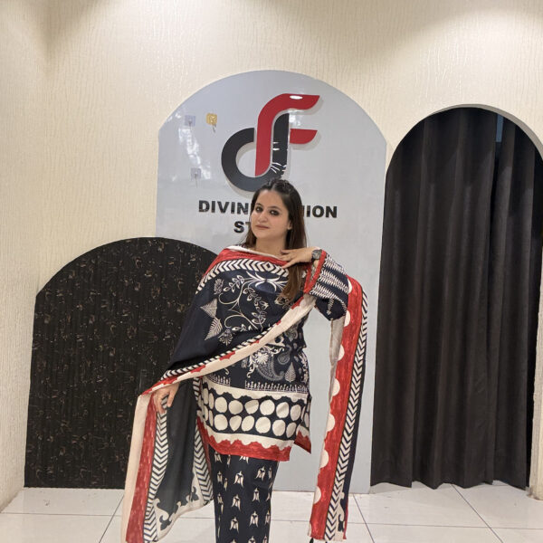 Elegant black Maslin suit featuring vibrant red and white prints with a matching dupatta