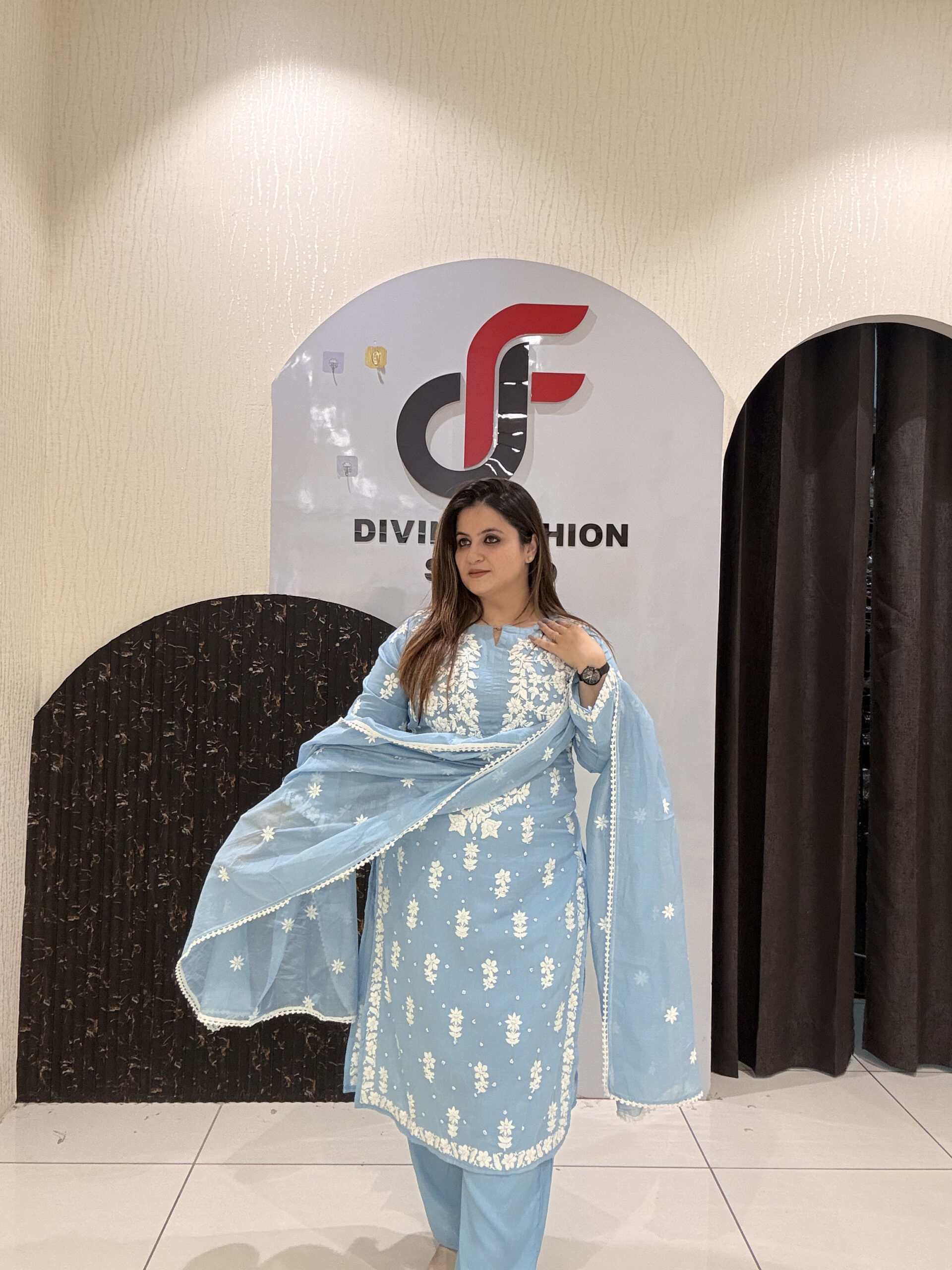 Premium sky blue mul cotton suit set featuring elegant thread embroidery on front and back with matching dupatta.