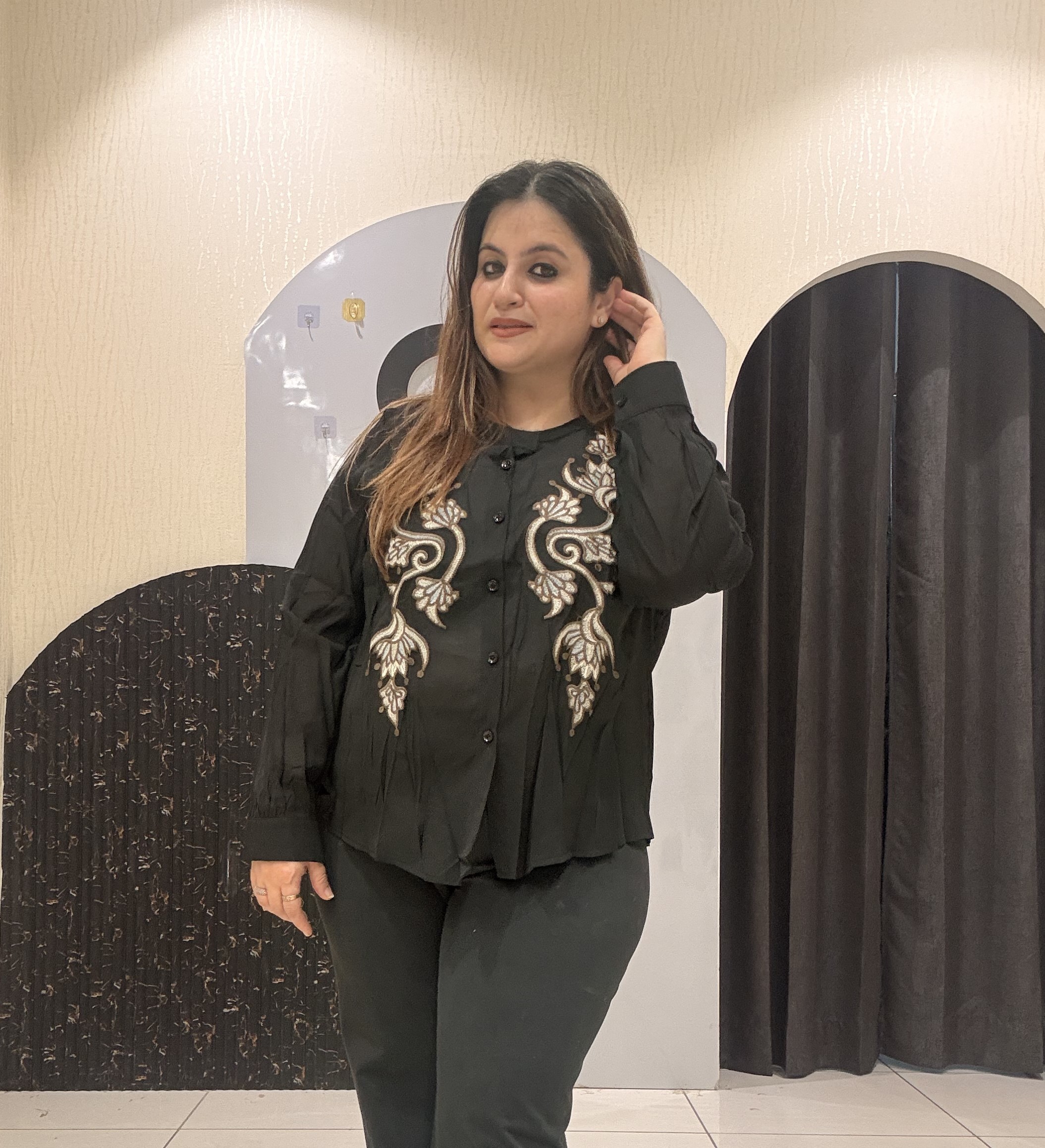Stylish tops featuring intricate front embroidery and a classic button-up design
