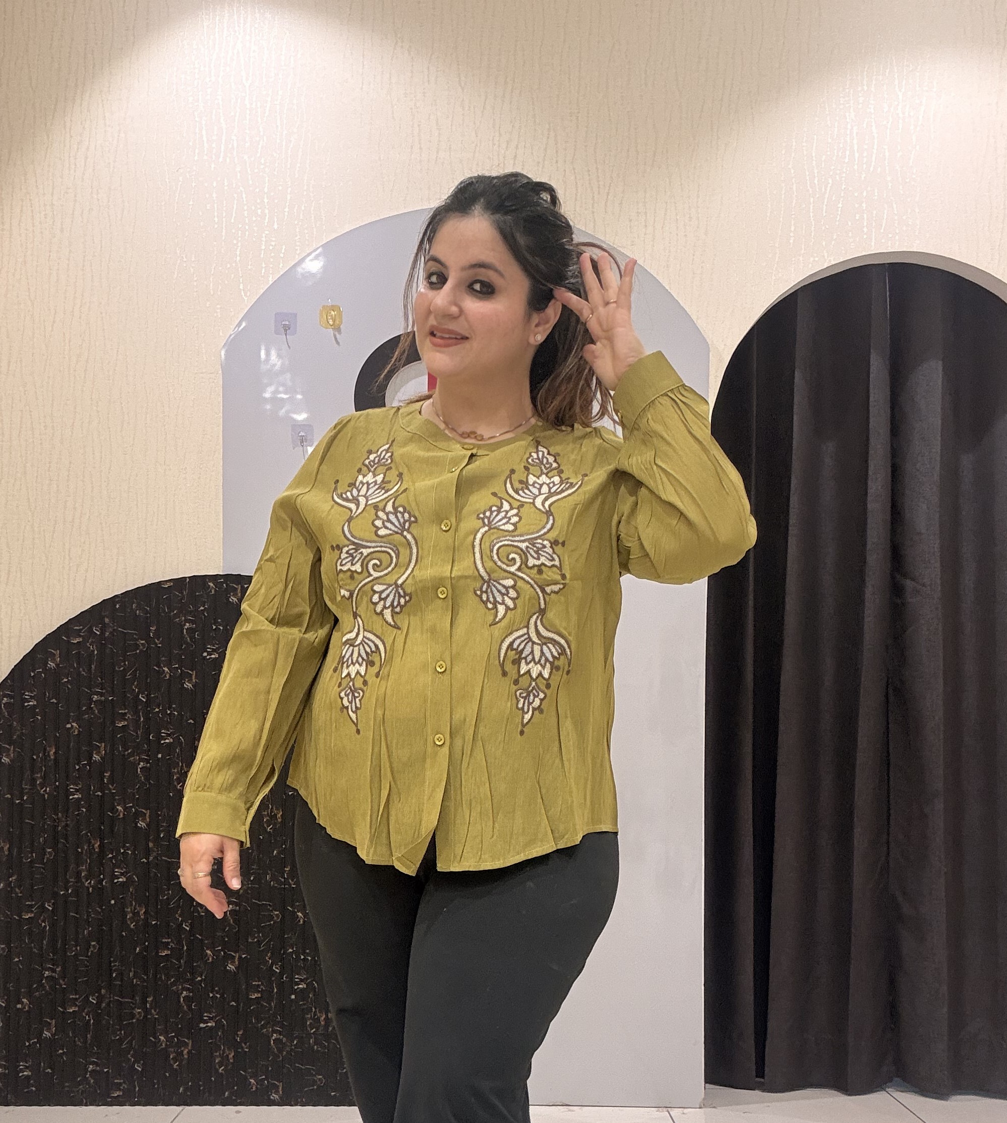 Stylish tops featuring intricate front embroidery and a classic button-up design