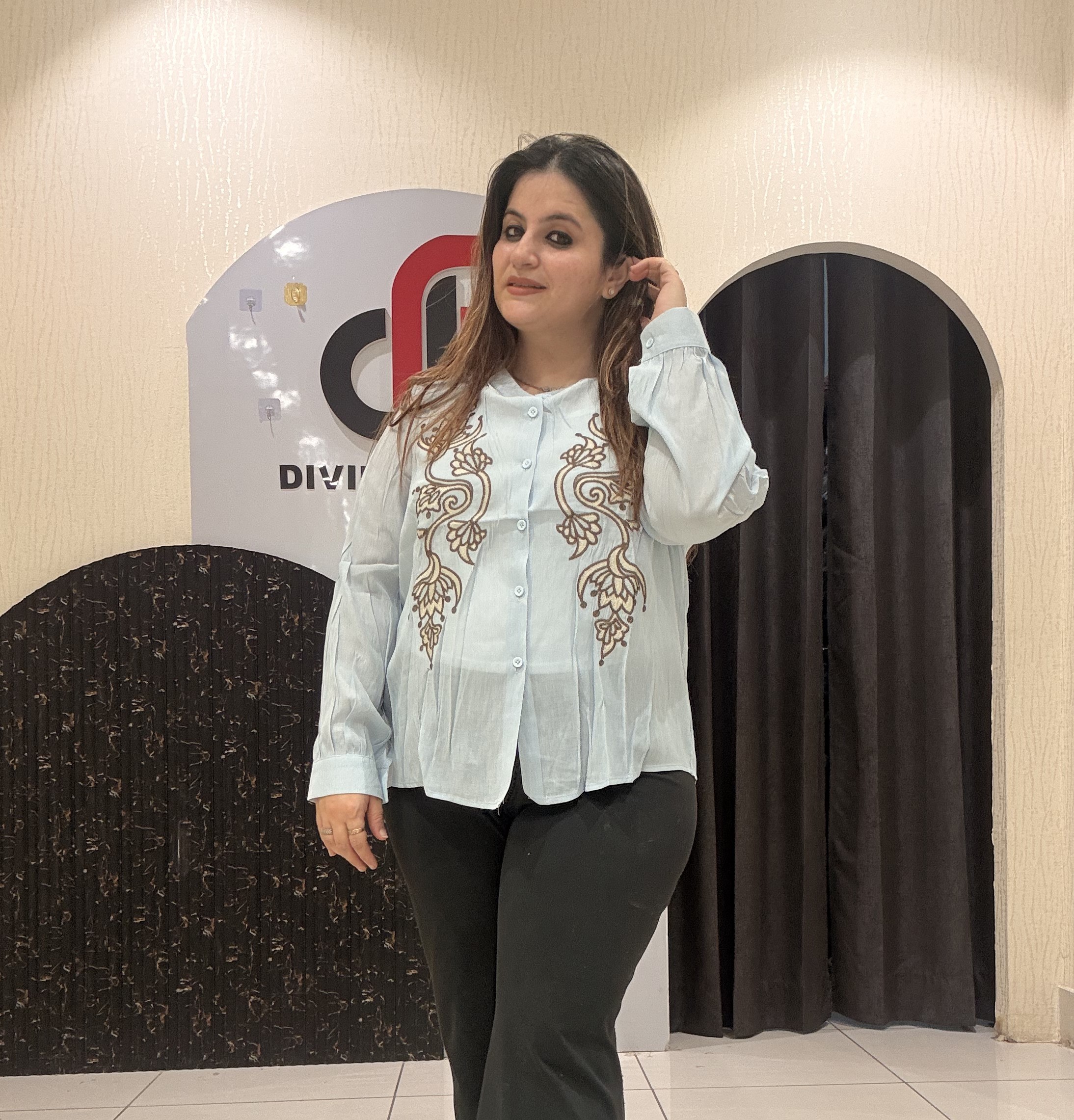 Stylish tops featuring intricate front embroidery and a classic button-up design