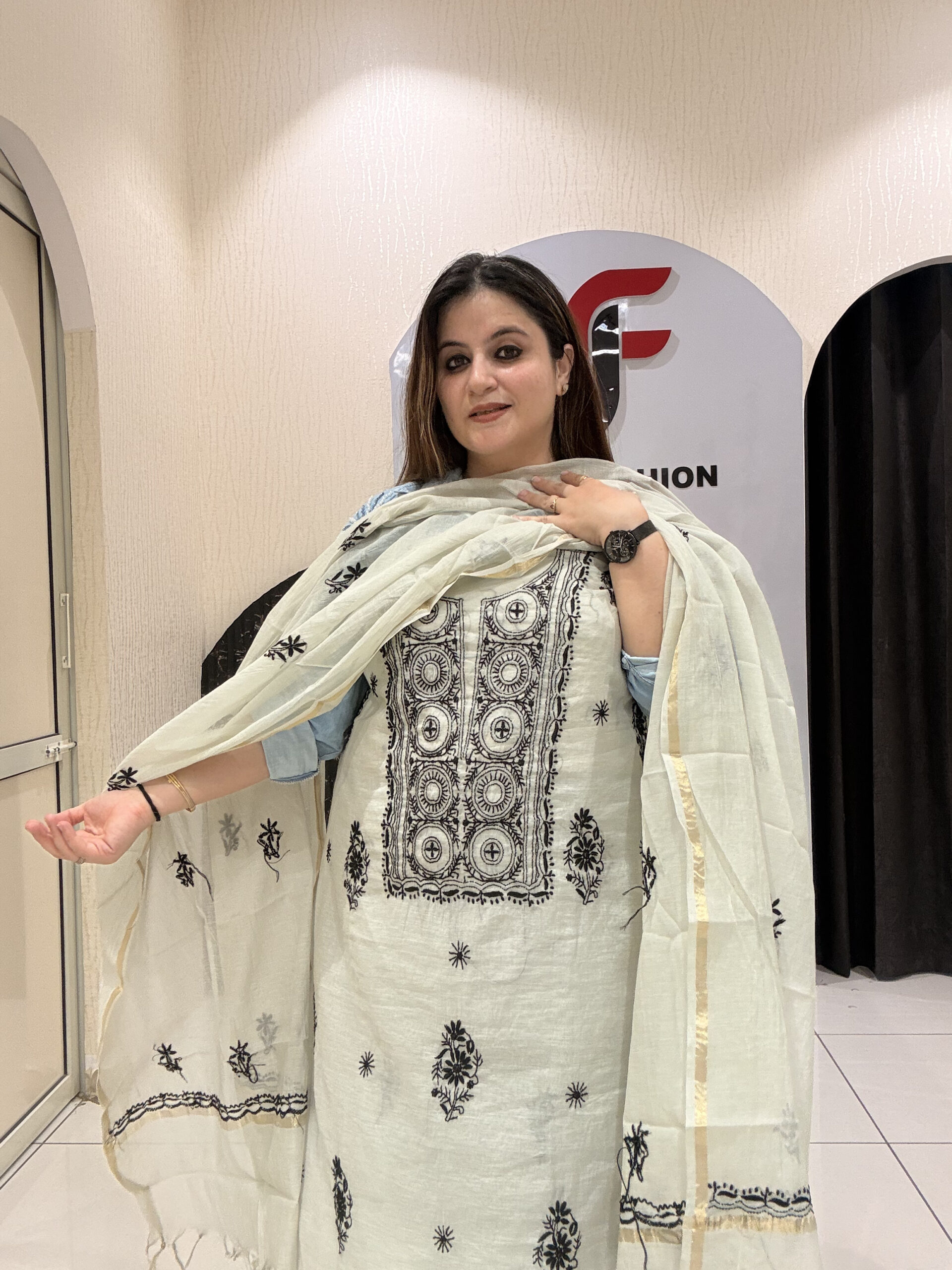 Premium grey unstitched mul cotton suit featuring intricate black thread embroidery and a matching dupatta