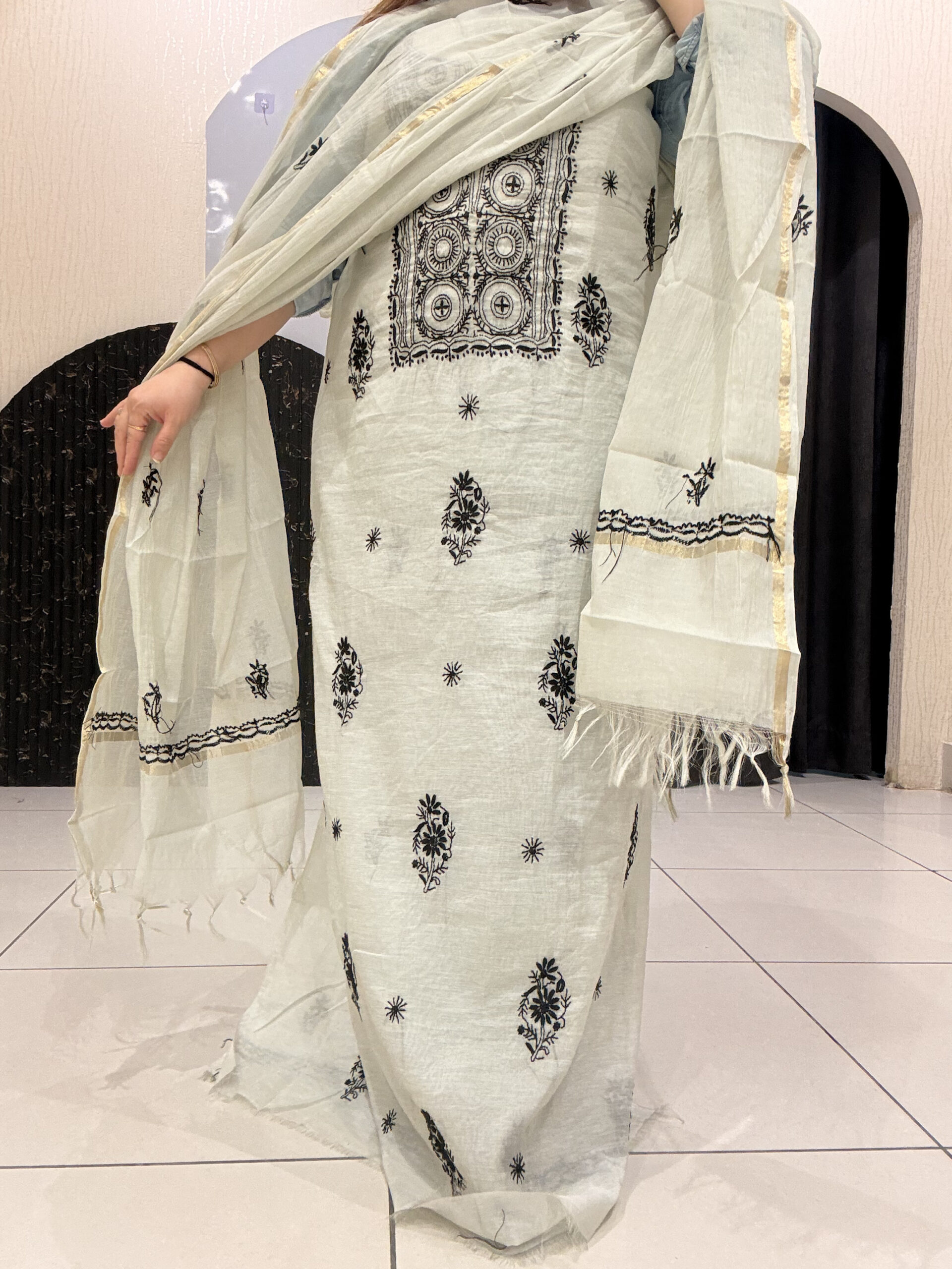 Premium grey unstitched mul cotton suit featuring intricate black thread embroidery and a matching dupatta