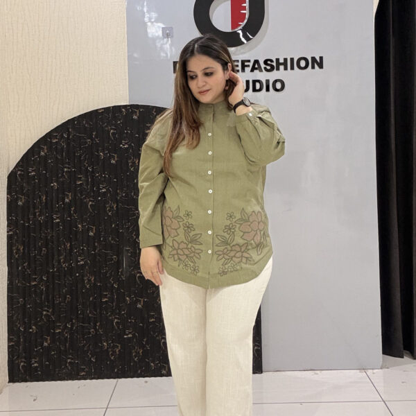Premium linen cotton coord set featuring floral embroidery on the shirt and paired with soft white trousers