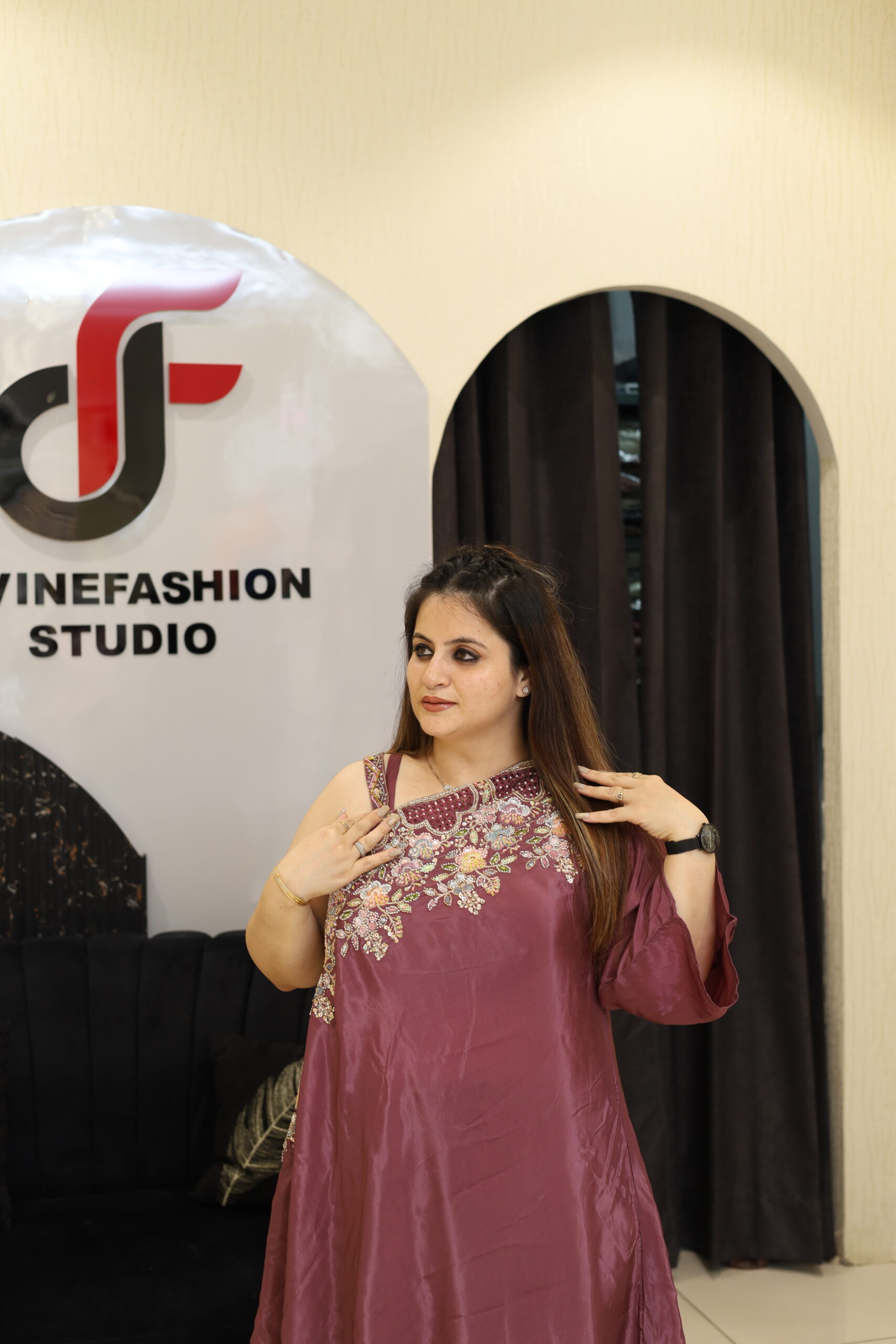 Woman in floral embroidered co-ord set at Divine Fashion Studio