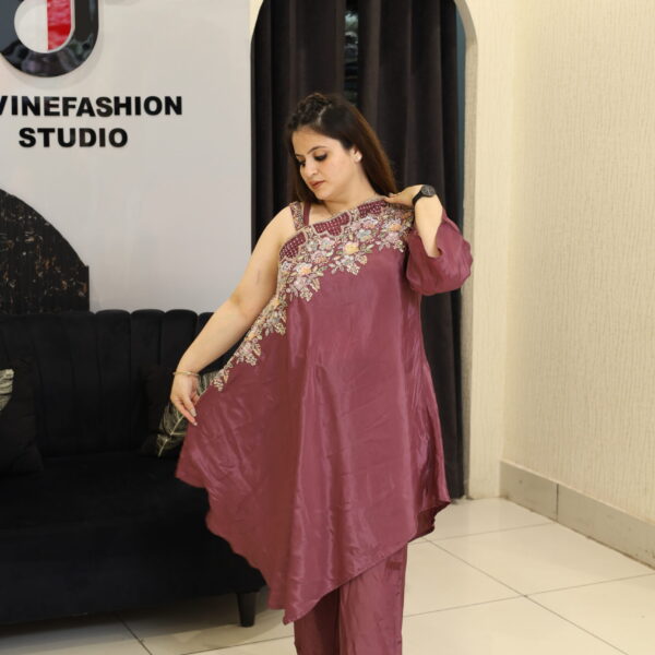Woman in a floral embroidered co-ord set in a studio