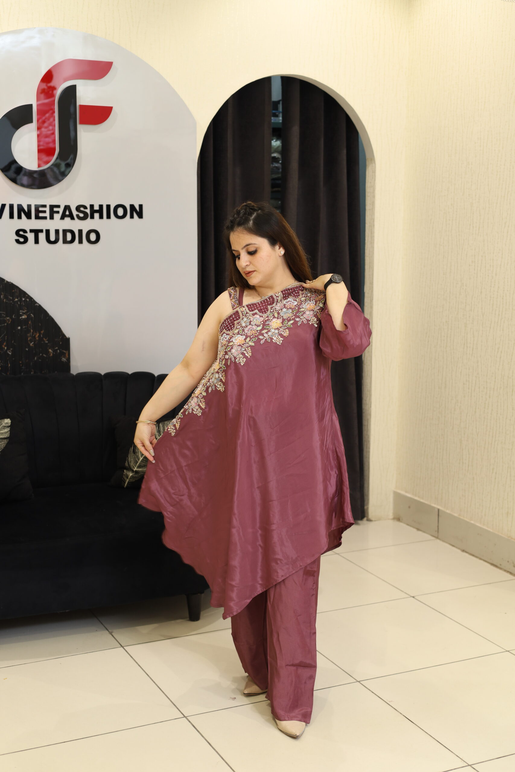Woman in a floral embroidered co-ord set in a studio