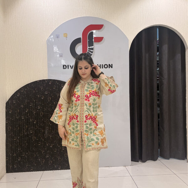 Graceful linen coord set featuring colorful thread embroidery and a relaxed silhouette