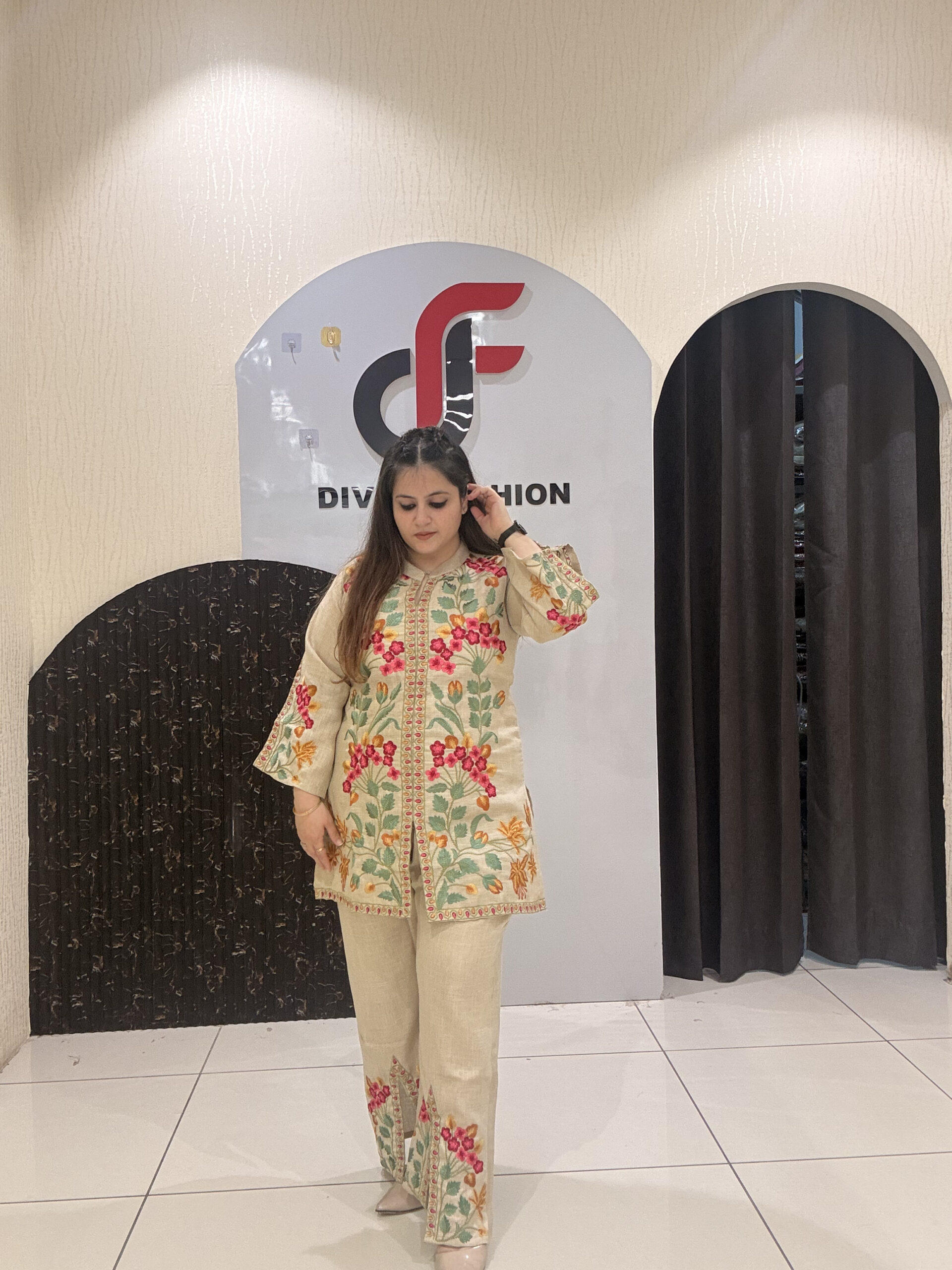 Graceful linen coord set featuring colorful thread embroidery and a relaxed silhouette