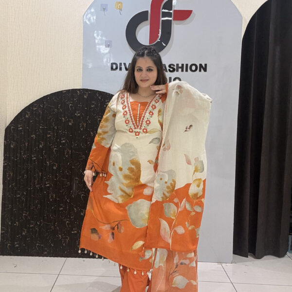 Elegant pure mul cotton suit featuring a beautiful leaf print in warm tones of orange and cream
