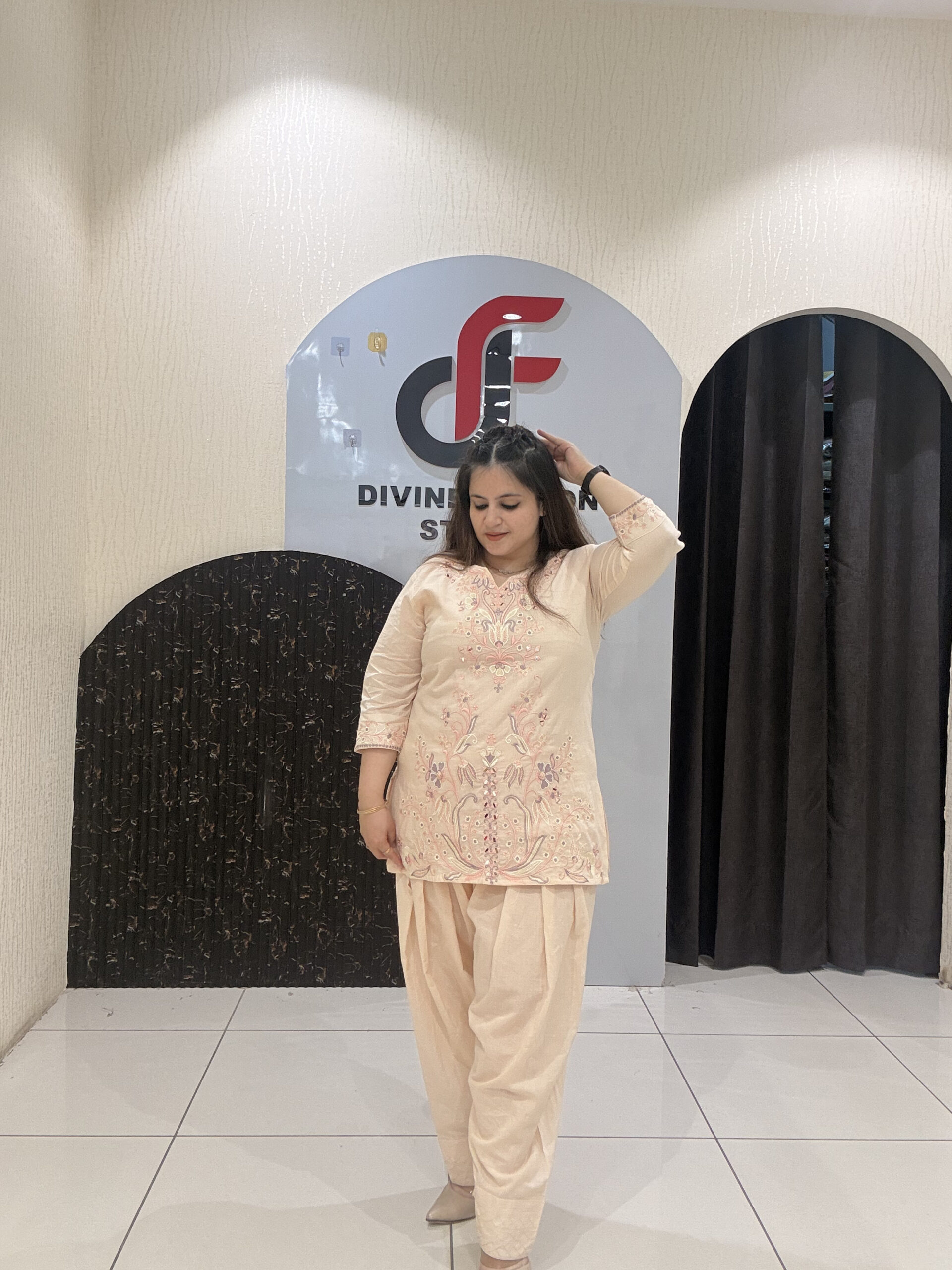 Graceful peach pure cotton suit featuring intricate embroidery and a traditional Farsi salwar design