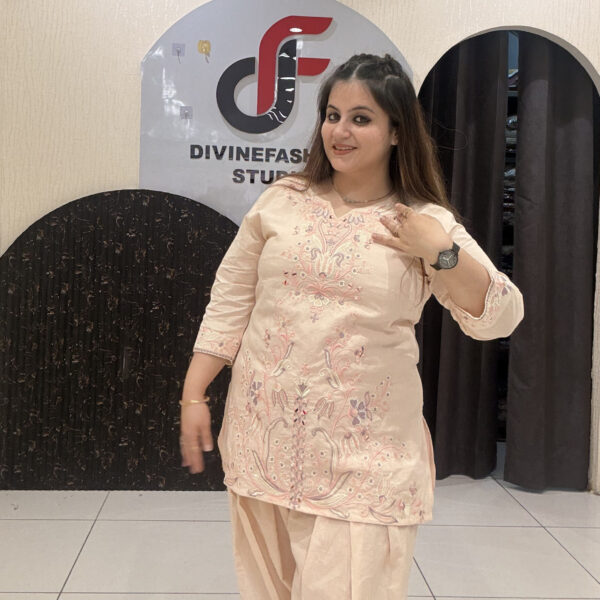 Graceful peach pure cotton suit featuring intricate embroidery and a traditional Farsi salwar design