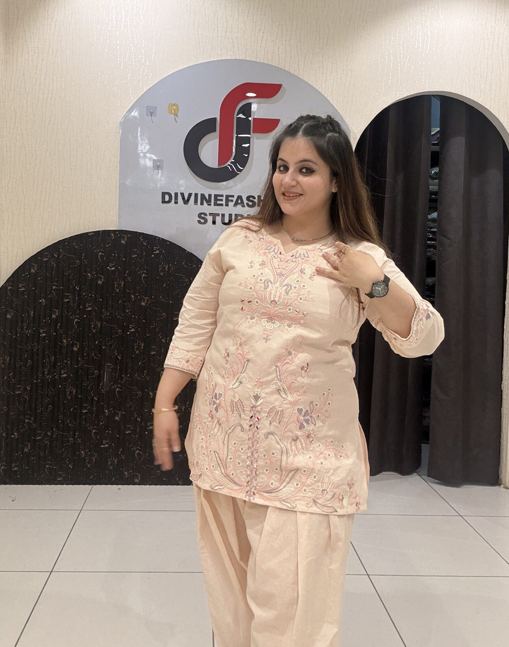 Graceful peach pure cotton suit featuring intricate embroidery and a traditional Farsi salwar design
