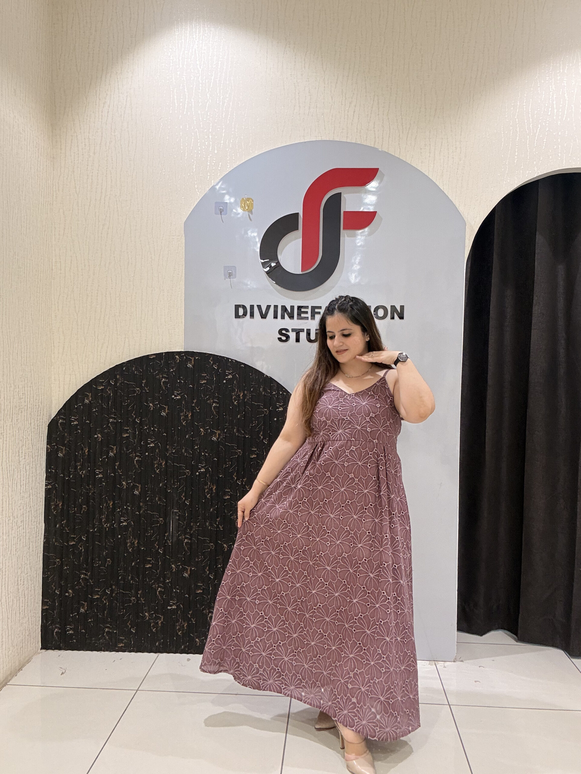 Stylish sleeveless cotton middi dress featuring delicate embroidery and a flowy silhouette