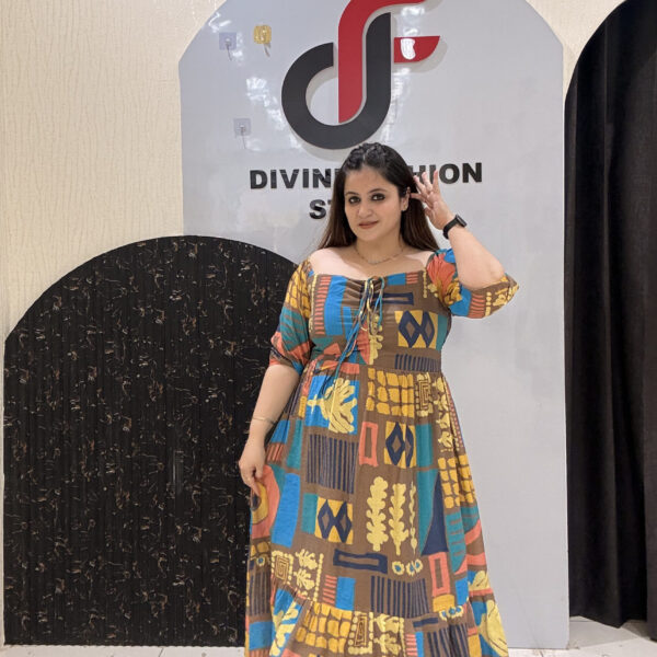 Eye-catching digital printed cotton middi featuring a mix of geometric and abstract patterns in rich hues of yellow, blue, and brown