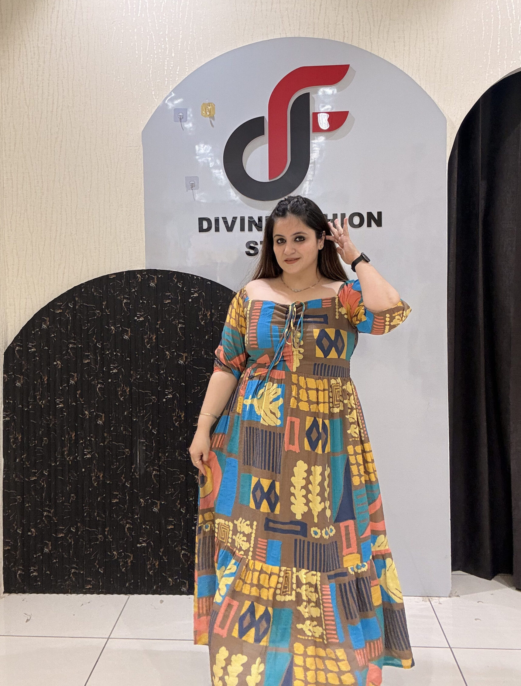 Eye-catching digital printed cotton middi featuring a mix of geometric and abstract patterns in rich hues of yellow, blue, and brown