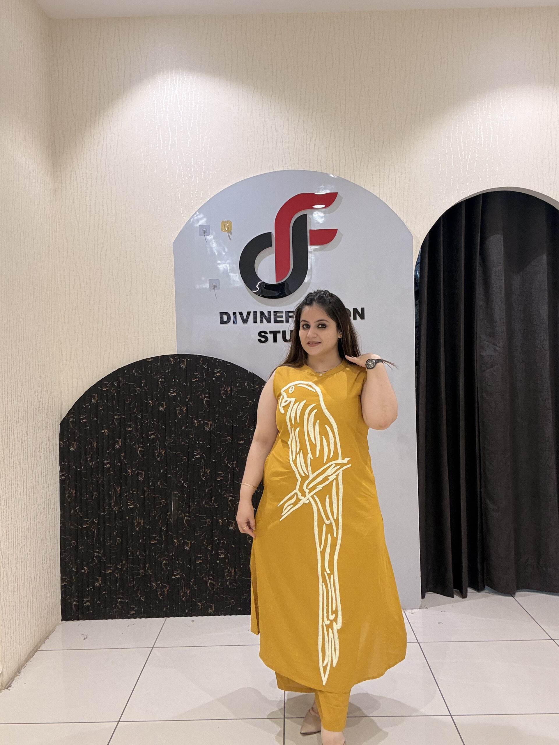 Stylish mustard cotton two-piece outfit featuring a striking parrot motif and matching pants