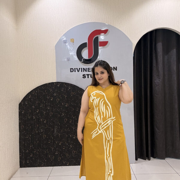 Stylish mustard cotton two-piece outfit featuring a striking parrot motif and matching pants