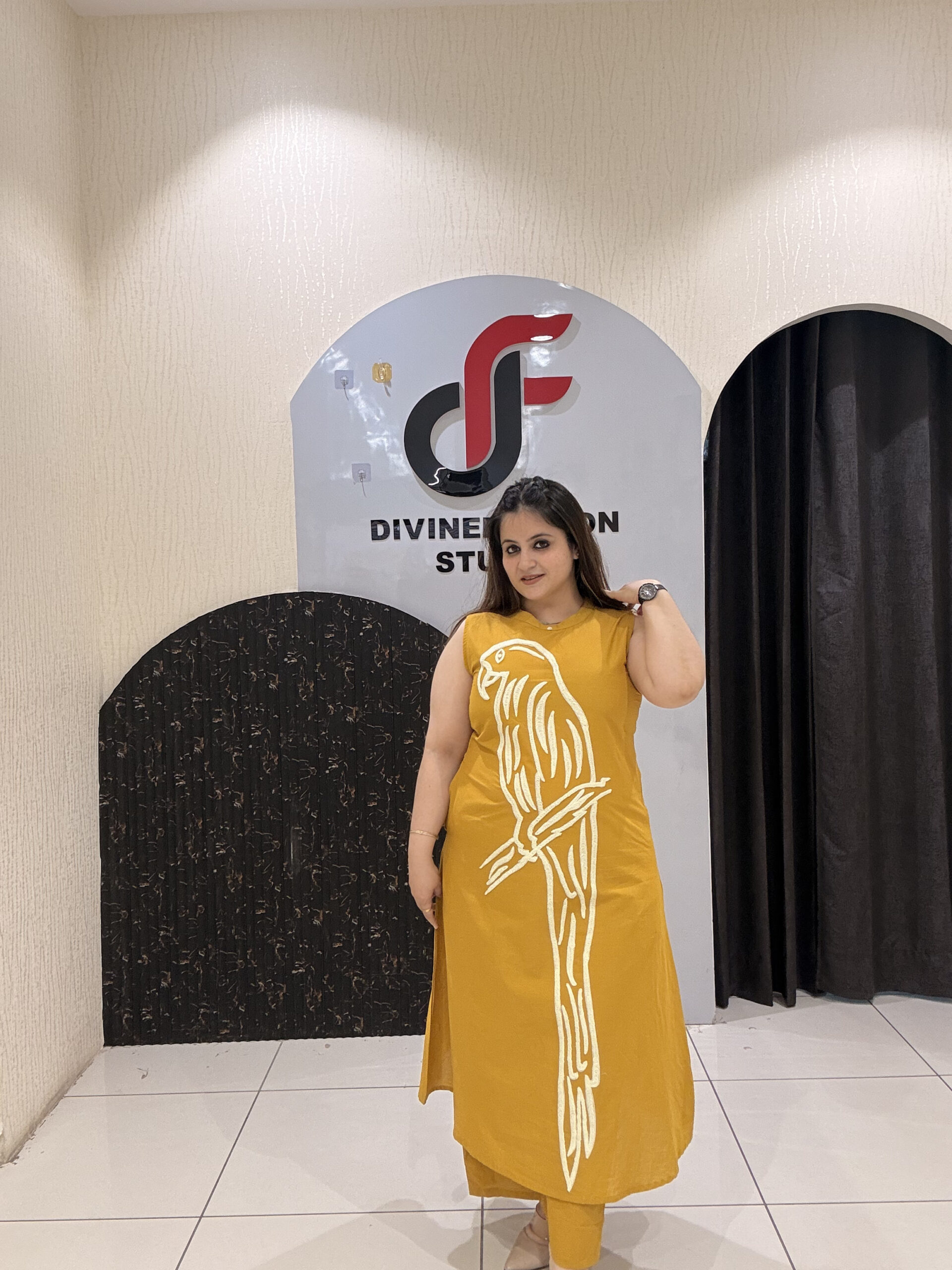 Stylish mustard cotton two-piece outfit featuring a striking parrot motif and matching pants