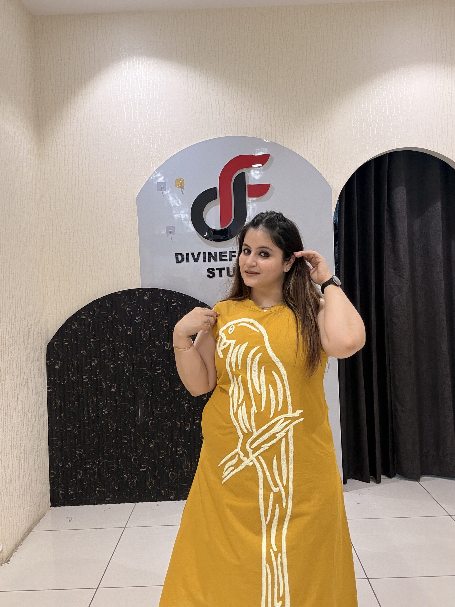 Stylish mustard cotton two-piece outfit featuring a striking parrot motif and matching pants