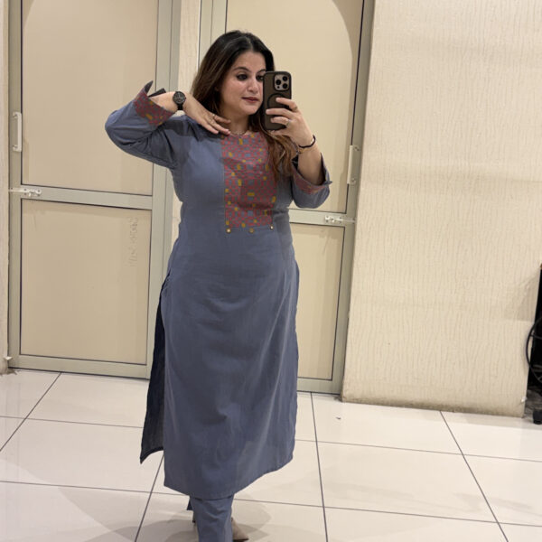 Elegant blue cotton two-piece outfit featuring intricate embroidery on the neckline and cuffs. Perfect for office wear, travel, or casual outings.