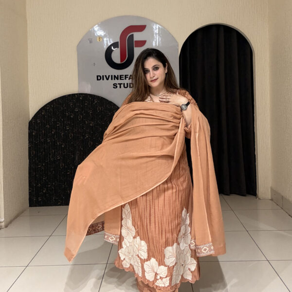 Graceful peach pure cotton suit featuring delicate white thread embroidery and a matching dupatta. Perfect for festive occasions, office wear, or elegant day outings